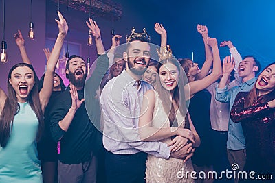 Portrait of crazy candid people mates shout raise hands wear stylish trendy formalwear dress suit disco discotheque Stock Photo