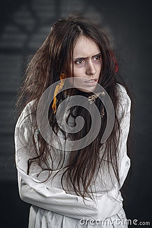 Portrait of a crazy woman in a straitjacket Stock Photo