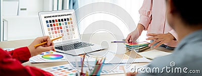 Graphic designer team select appropriate color for project. Closeup. Variegated. Stock Photo