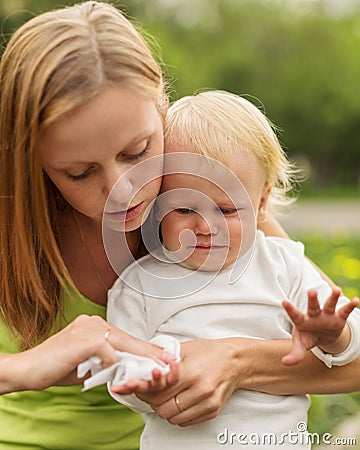 Portrait of a crying little boy who is being held Stock Photo