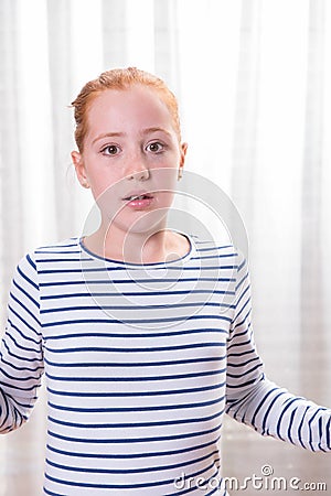 Portrait crying teenage girl looking into camera Stock Photo