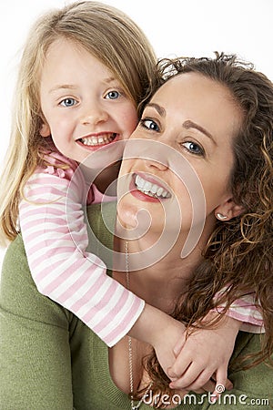 Portrait Of Cuddling Mother And Child Stock Photo