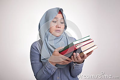 Muslim Woman Sick and Tired Reading Too Much Books Stock Photo