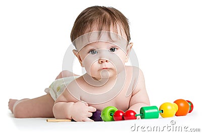 Portrait of cute baby boy with developmental wooden toys. Stock Photo