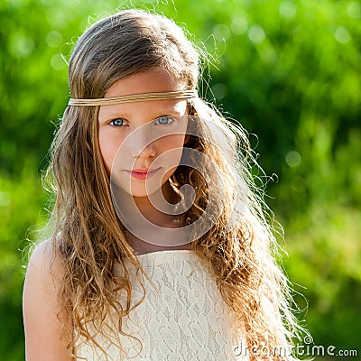 Portrait of cute girl wearing ribbon headband. Stock Photo
