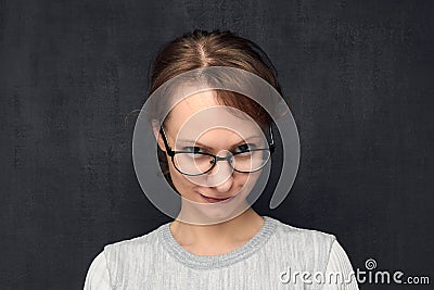 Portrait of cute and intrigued girl with eyeglasses Stock Photo