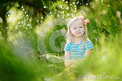 Portrait of cute little cheerful girl outdoors Stock Photo