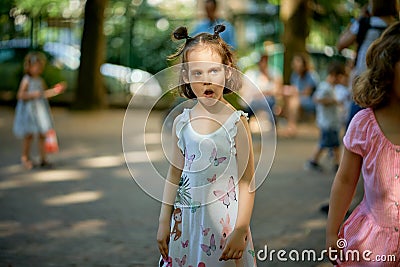 Portrait of cute little girl at playground on summer day Stock Photo