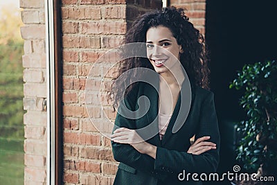 Portrait cute millennial charming freelancer content glad rejoice satisfied enjoy excited relaxed long wavy curly hair Stock Photo