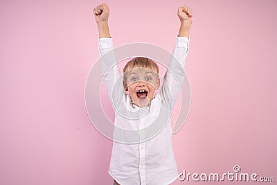 Portrait of cute trendy stylish kid astonished impressed aims contest lottery fortune, scream omg, wow, unbelievable unexpected Stock Photo