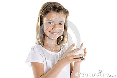 Portrait of a cute 7 years old girl Isolated over white background with milk glass Stock Photo