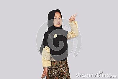 Portrait of cute A young asian little girl 6-7 years old muslim, wearing hijab, show face expression Stock Photo