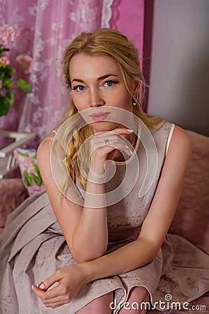 Portrait of a cute young blonde in a beautiful short dress Stock Photo