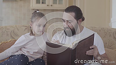 Portrait of Daughter and Her Father Sitting in Living Room and Looking  Photo Album with Good Memories and Funny Stories Stock Footage - Video of  conversation, child: 141861116