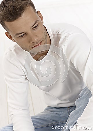 Portrait of daydreaming young man Stock Photo