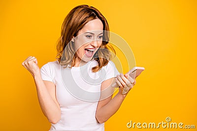 Portrait delighted cheerful youngster youth raise fist shout yeah news feed user modern technology wireless connection Stock Photo