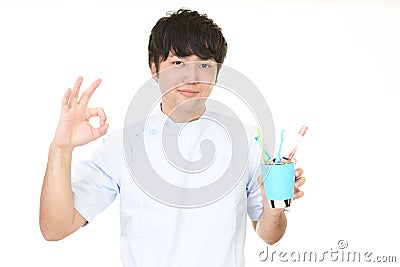 Smiling dental hygienist Stock Photo