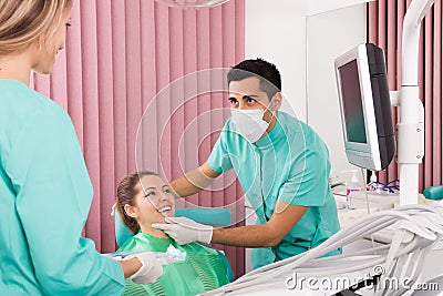 Portrait of dentist and patient at dental clinic Stock Photo