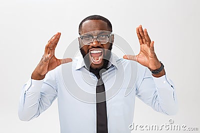 Portrait of desperate annoyed black male screaming in rage and anger tearing his hair out while feeling furious and mad Stock Photo