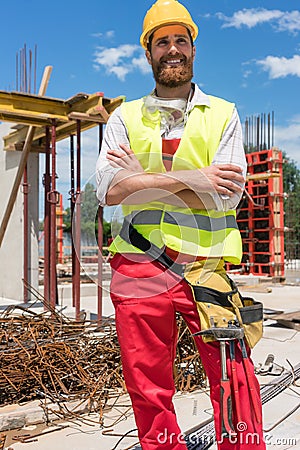 Portrait of a determined young worker looking at camera with con Stock Photo