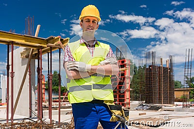 Portrait of a determined young worker looking at camera with con Stock Photo