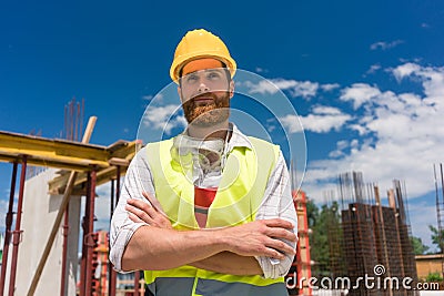 Portrait of a determined young worker looking at camera with con Stock Photo