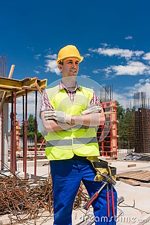 Portrait of a determined young worker looking at camera with con Stock Photo