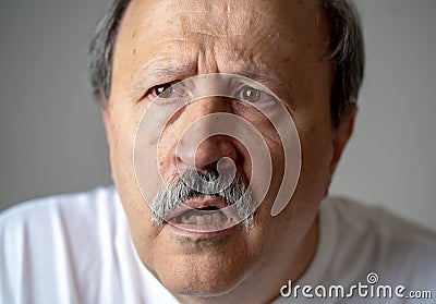 Portrait of disorientated and confused old man suffering from Alzheimer Stock Photo