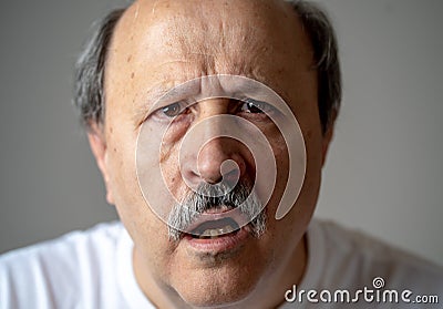 Portrait of disorientated and confused old man suffering from Alzheimer Stock Photo