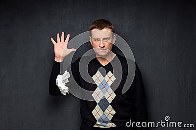 Portrait of displeased man letting go of crumpled paper Stock Photo