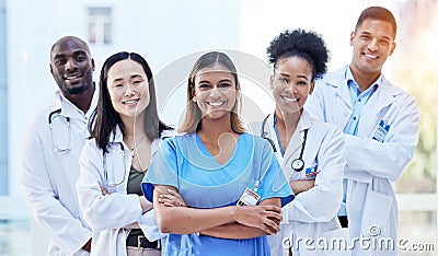 Portrait, doctors and arms crossed with smile for teamwork, healthcare and hospital management. Group of happy medical Stock Photo