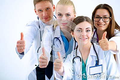 Portrait of doctors team showing thumbs up Stock Photo