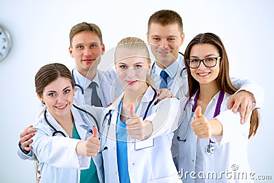 Portrait of doctors team showing thumbs up Stock Photo