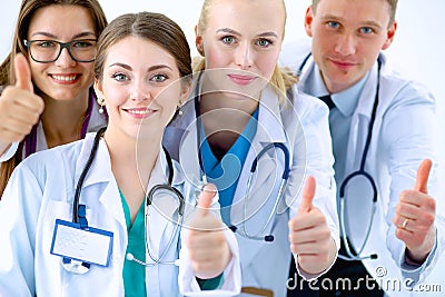 Portrait of doctors team showing thumbs up Stock Photo