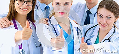 Portrait of doctors team showing thumbs up Stock Photo