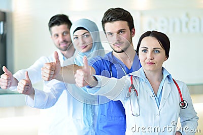 Portrait of doctors team showing thumbs up Stock Photo