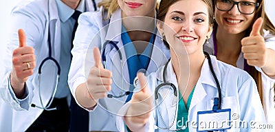 Portrait of doctors team showing thumbs up Stock Photo