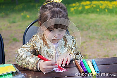 Portrait of a drawing girl Stock Photo