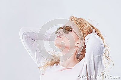 Portrait of a dreaming pretty girl in sunglasses. Stock Photo