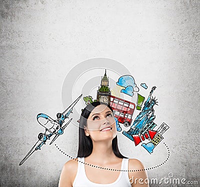 A portrait of a dreamy brunette lady in a white tank top. A concept of travelling and holidays. Stock Photo