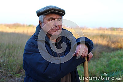 The portrait of an elderly European peasant pondered Stock Photo