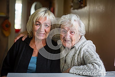 Portrait of an elderly happy woman with her adult daughter. Stock Photo