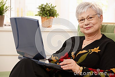 Portrait of elderly lady with computer Stock Photo