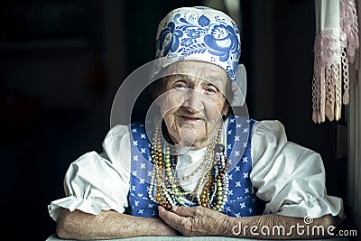 Portrait of an elderly woman in ethnic Russian or Ukrainian clothes. Stock Photo