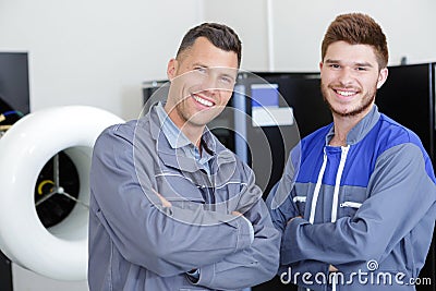 portrait electrician with apprentice Stock Photo