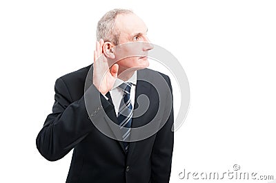 Portrait of elegant senior making can`t hear you gesture Stock Photo