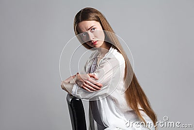 Portrait of emotional worry young model actor with long brown ha Stock Photo