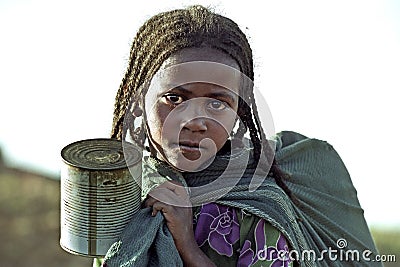 Portrait of Ethiopian girl fetching water Editorial Stock Photo