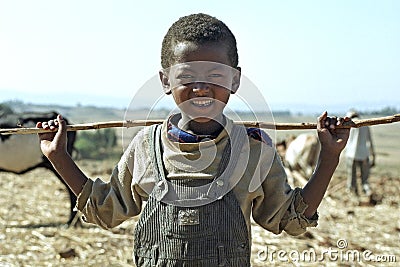 Portrait Ethiopian Oromo boy with stick Editorial Stock Photo