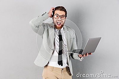 Portrait of an excited businessman dressed in suit Stock Photo